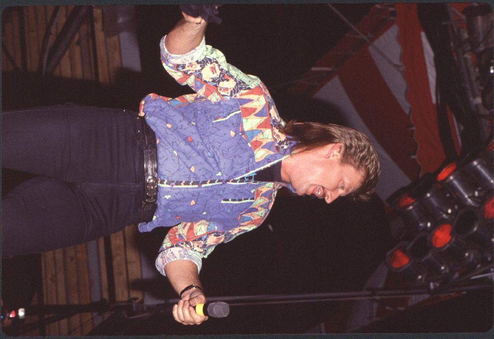 Joe Diffie On Stage Photo Print capturing a vibrant concert performance.