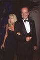 Camille Meyer in black dress and Kelsey Grammer in tuxedo at Carousel of Hope event photo print.