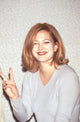 Drew Barrymore giving a peace sign at the Female Health Foundation event photo print.