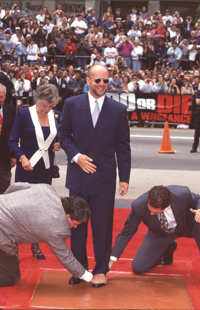 Bruce Willis Footprints Ceremony Photo Print capturing an iconic Hollywood moment.