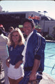 Donna Mills in white shorts and blue top with Jared Martin at Battle of the Network Stars Photo Print