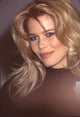 Close-up photo print of Claudia Schiffer in a black turtleneck.