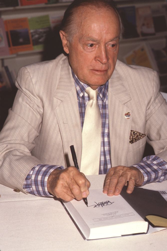 Bob Hope signing his book photo print - 8x10, 16x20, 24x30 sizes available.