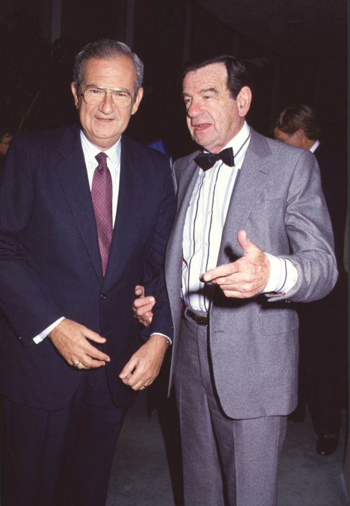 Isadore Rosenfeld portrait photo print in navy suit and gray suit with red tie and bow tie.