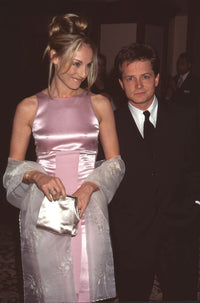 Tracy Pollan in pink gown and Michael J. Fox in black suit photo print.