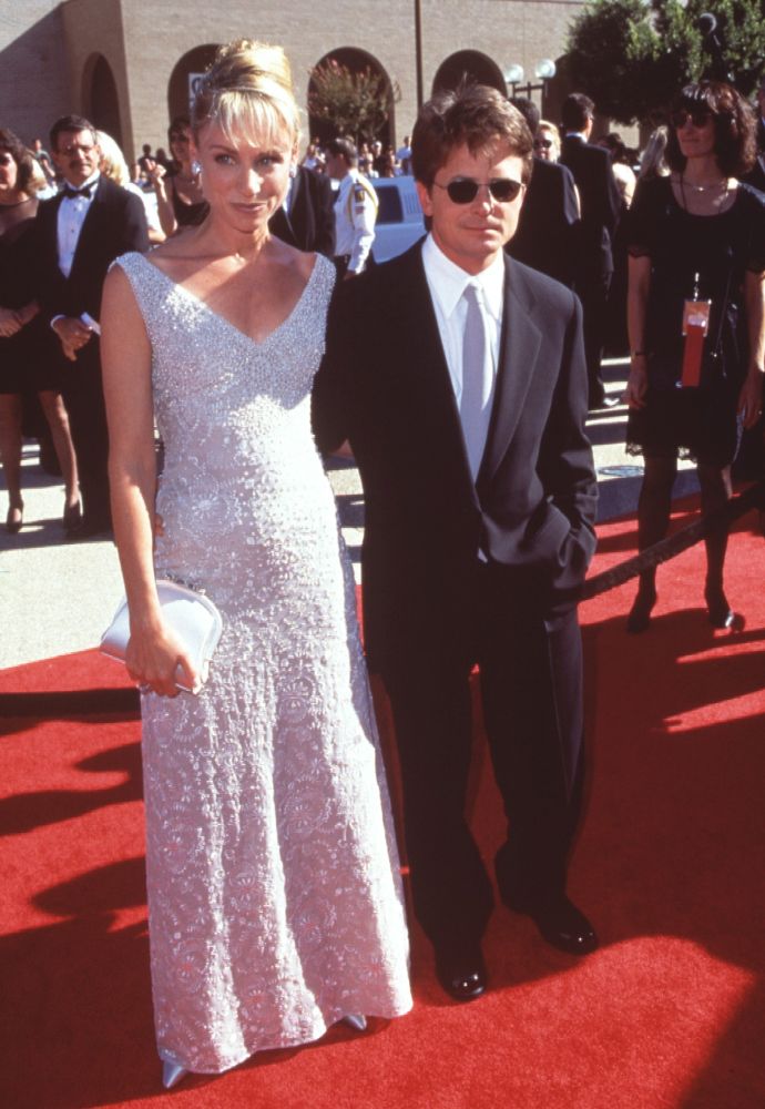 Tracy Pollan in white beaded gown with Michael J. Fox at 50th Emmy Awards photo print.