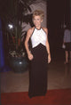 Vanna White in black halter dress with white lace top at Carousel of Hope photo print.