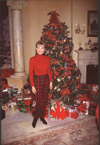 Vanna White in red sweatshirt and plaid pants in front of Christmas tree photo print