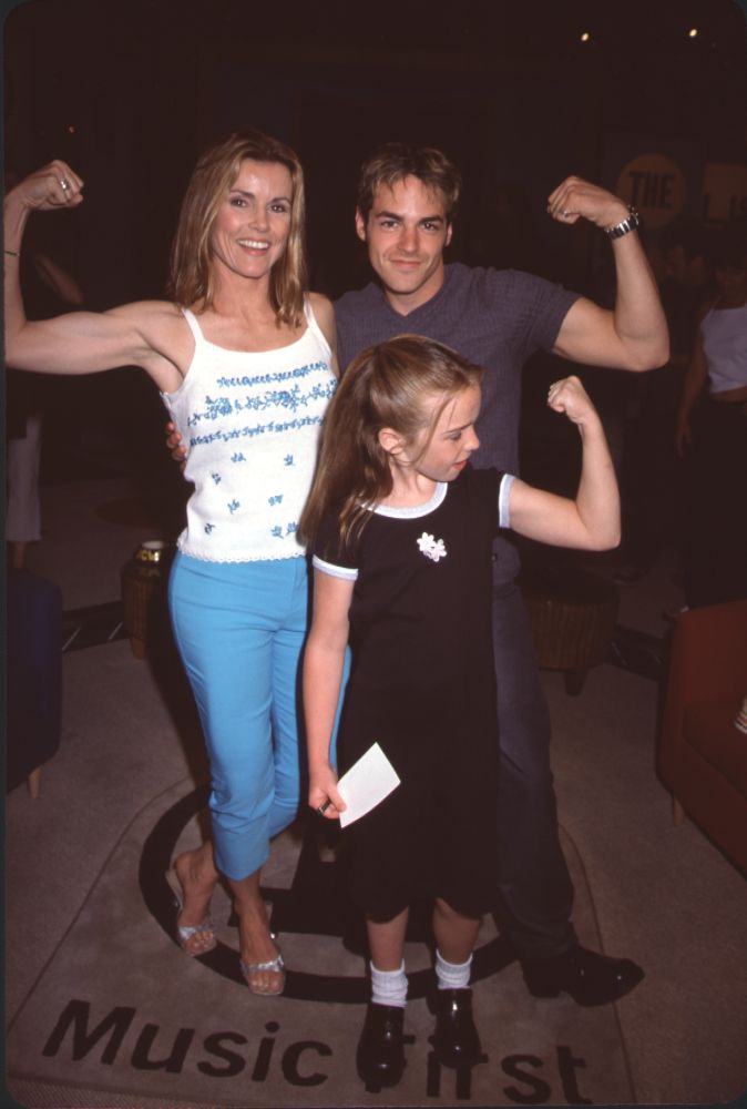 Alex Donnelley flexing with David Lago and Camryn Grimes at The Young & The Wrestler event photo print.
