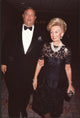 Marvin Davis in tuxedo and Barbara Davis in black lace dress photo print