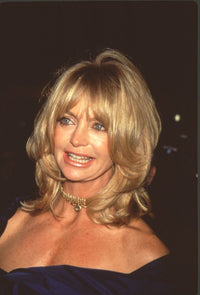 Goldie Hawn in navy off-shoulder dress with gold choker photo print.