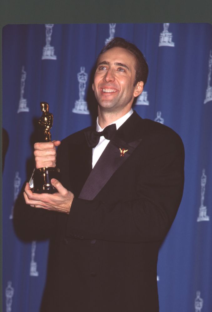Nicolas Cage holding award at the 68th Academy Awards photo print