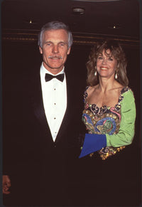 Ted Turner in tuxedo with Jane Fonda in multicolored dress photo print.