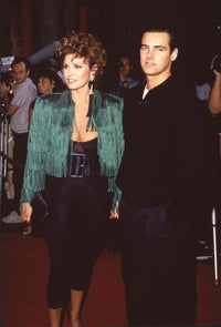 Raquel Welch in green tassle jacket and black pants with her son Damon Welch photo print.