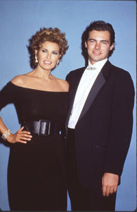 Raquel Welch in black off-shoulder dress with son Damon photo print.