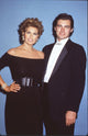 Raquel Welch in black off-shoulder dress with son Damon photo print.