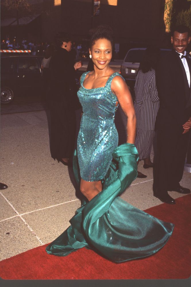 Suzzanne Douglas wearing a green sequin dress and jacket at NAACP Image Awards photo print