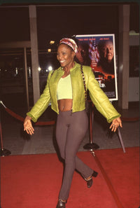 Suzzanne Douglas at Most Wanted premiere in brown pants and green jacket photo print