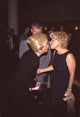 Bette Midler kissing Barbara Davis at The First Wives Club premiere photo print.