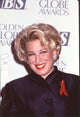 Bette Midler photo print in black jacket with red ribbon pin