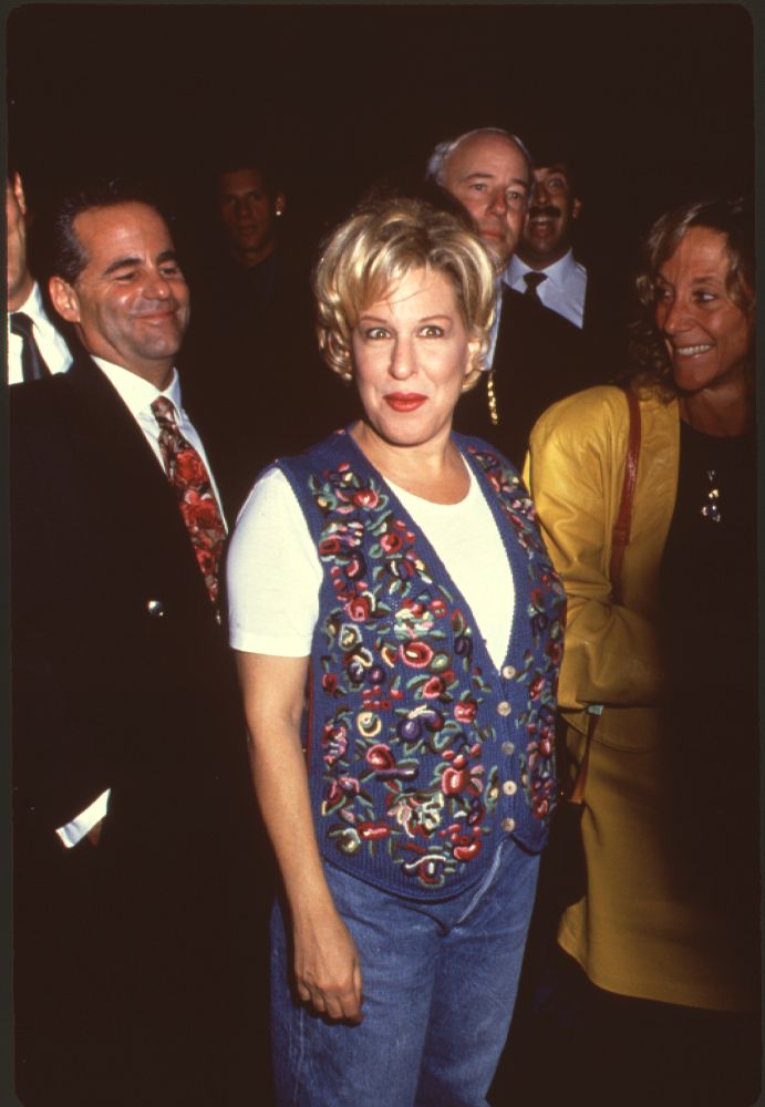 Bette Midler photo print in jeans and sweater vest, available in multiple sizes.