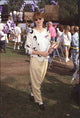 Geena Davis photo print wearing yellow pants and a white and black sweater.