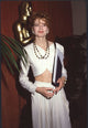 Geena Davis photo print in white pants and cropped jacket