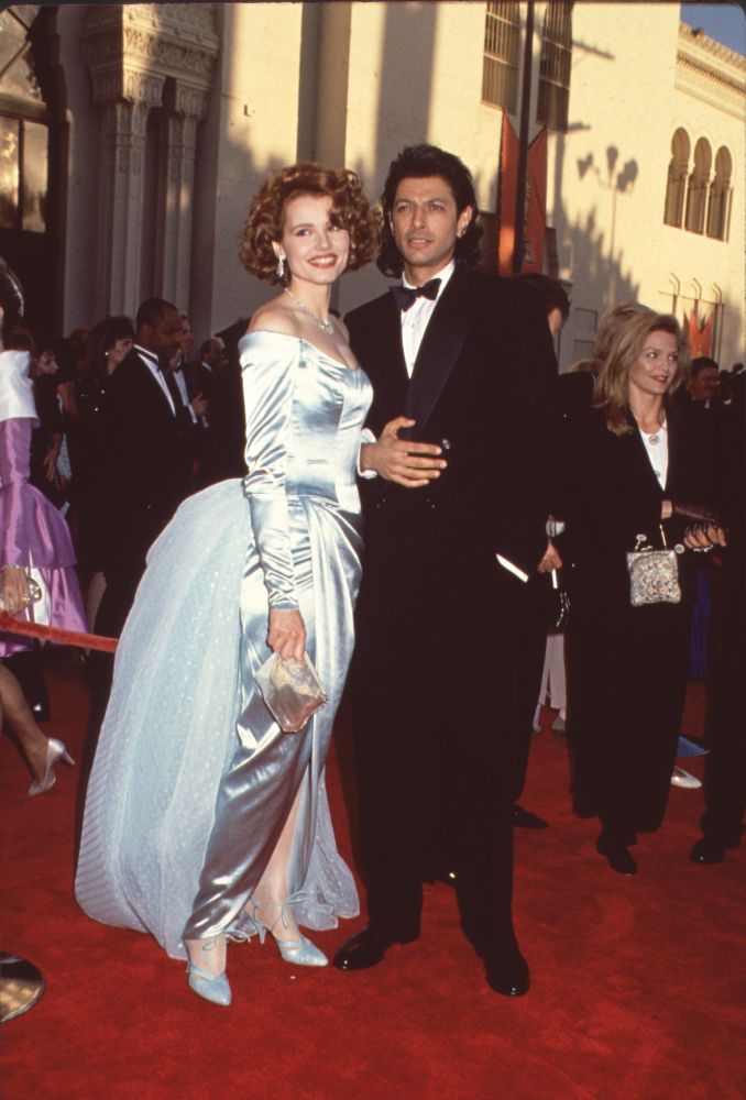 Geena Davis in blue off shoulder gown with Jeff Goldblum in tuxedo at Oscars photo print
