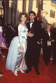 Geena Davis in blue off shoulder gown with Jeff Goldblum in tuxedo at Oscars photo print