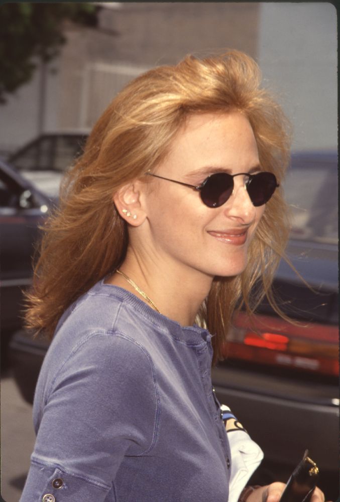 Close-up photo print of Marlee Matlin in blue shirt and sunglasses at celebrity pool event.