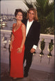 Yasmine Bleeth in red gown with Jaason Simmons at Baywatch party photo print