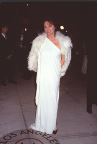 Jacqueline Bisset in white gown and feather boa at Vanity Fair Oscar Party photo print