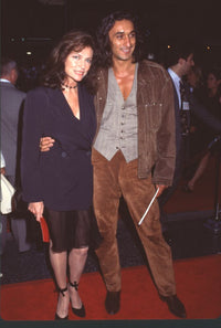 Jacqueline Bisset in sheer skirt and navy blazer at Waterworld premiere photo print.