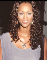 Close-up photo print of Tyra Banks in a tan shirt at the 1994 Crystal Awards.