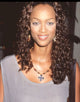 Close-up photo print of Tyra Banks in a tan shirt at the 1994 Crystal Awards.