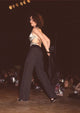 Kim Delaney on stage taking off jacket at Eras Center Fashion Show photo print.