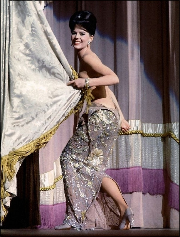 Natalie Wood Pulling Curtain Photo Print showcasing classic Hollywood elegance.