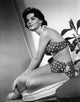 Natalie Wood Sideways Sit in Bikini Photo Print showcasing classic Hollywood glamour.