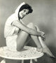 Natalie Wood sitting on table in hooded top photo print