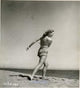 Running on Beach Photo Print by Alexis Smith, showcasing a serene beach scene.