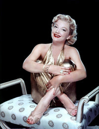 Anne Baxter in a gold jumpsuit photo print, capturing classic Hollywood glamour.