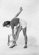 Anne Francis Touching Toes Photo Print showcasing vintage elegance