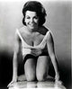 Annette Funicello kneeling on surfboard photo print.