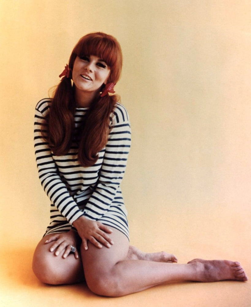 Ann Margret Sitting Stripes Photo Print, capturing classic beauty.