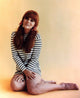Ann Margret Sitting Stripes Photo Print, capturing classic beauty.