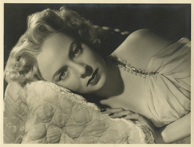 Aurdey Totter Laying Down Photo Print showcasing elegance and charm.