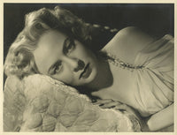 Aurdey Totter Laying Down Photo Print showcasing elegance and charm.