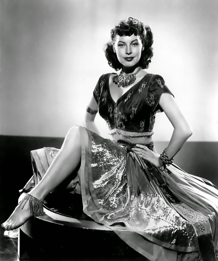 Ava Gardner On Table Photo Print showcasing the iconic actress in a timeless pose.