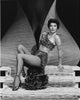 Ava Gardner Fishnets Pose Photo Print showcasing classic Hollywood glamour.