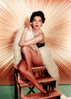 Ava Gardner Pose on Steps Photo Print showcasing classic Hollywood elegance.